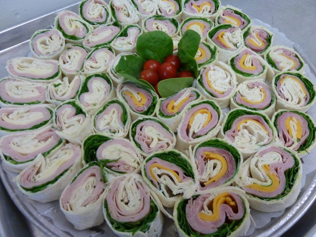 closeup of deli cheese and meat tray catering
